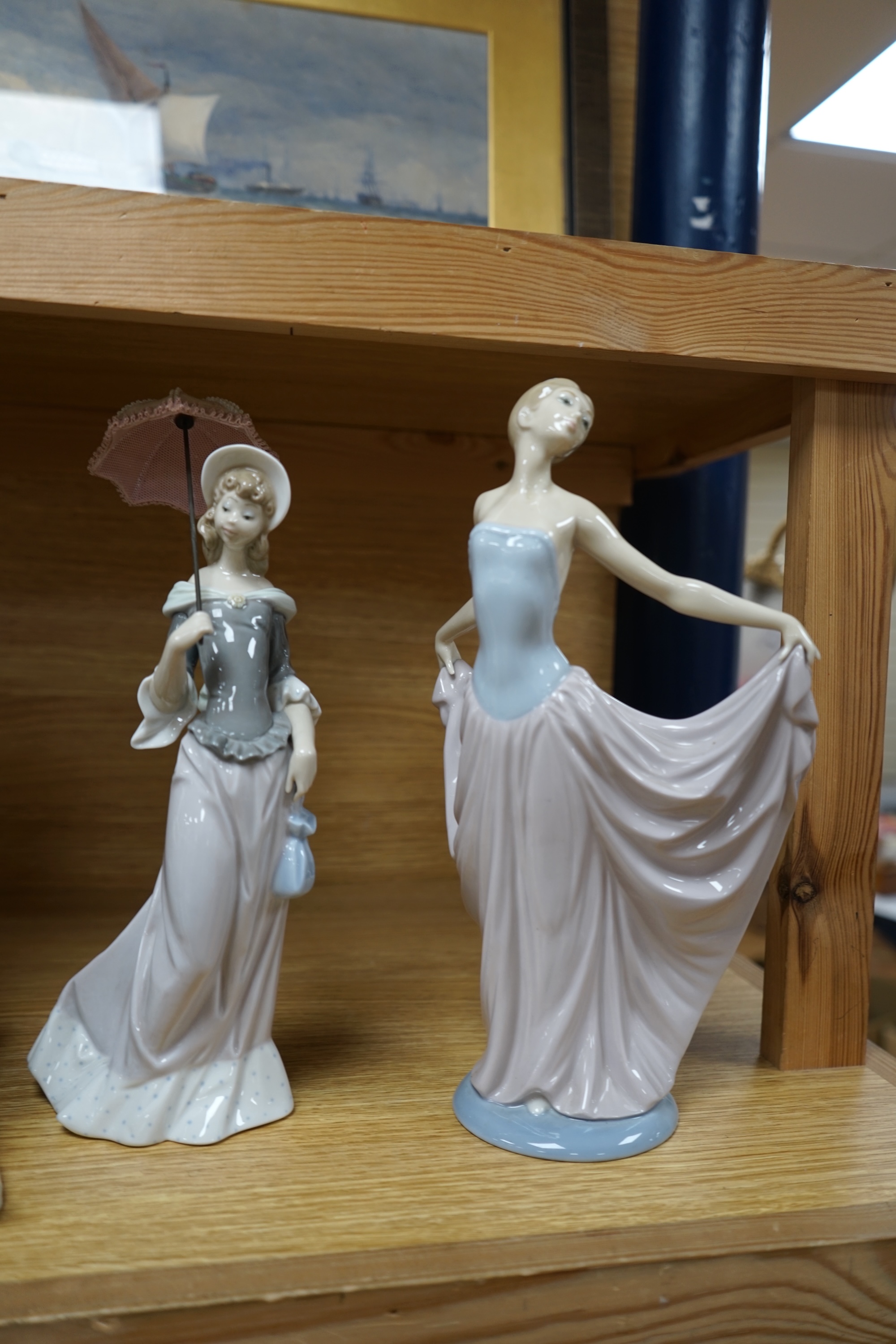 Three Lladro figure groups to include a dancer and a seagull together with another Spanish porcelain group, largest 31cm high. Condition - good